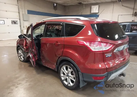 2016 Ford Escape Titanium z USA, uszkodzony, nr VIN 1FMCU9JX5GUA79598